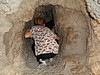 Allison in water channel Qumran.JPG